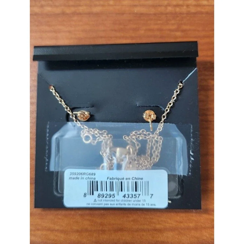 COACH Rose Gold Halo Necklace and Matching Flower Earring Set MSRP. $125